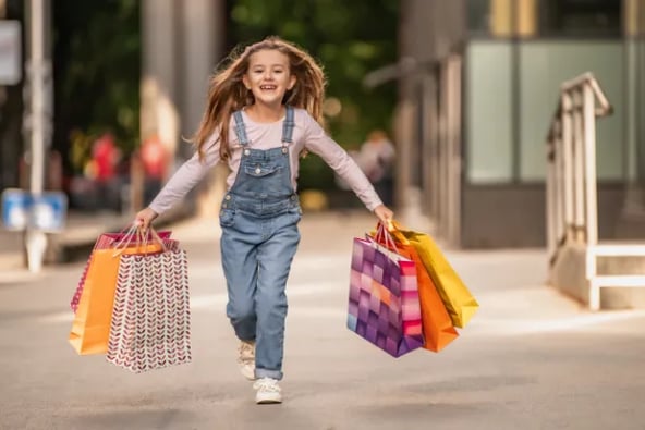 Little girl with shopping bags