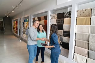 Saleswoman greeting customers