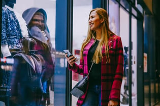 Female customer smiling as she visits store