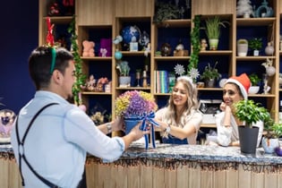 florist employees with holiday hats