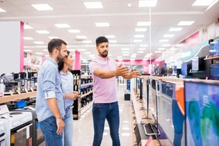 Salesman discussing product with customers