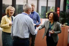 Shaking hands at a conference