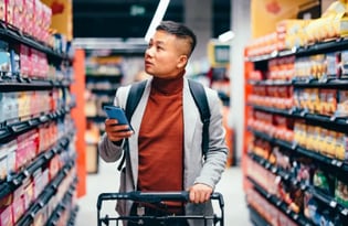 Man checking prices on his phone