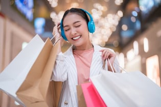 woman shopping with headphones on