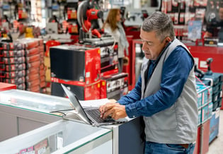 salesman on phone in hardware store