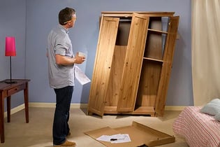 Man looking at sideways DIY project