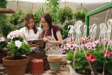 Two saleswomen planning for SBS