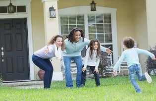 parents with arms open wide