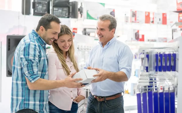 retail salesman working with customers